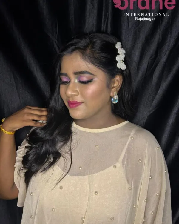 A trendy lavender eye makeup look demonstrated for our students. We teach how to create modern, fashion-forward looks that are popular with clients today.
