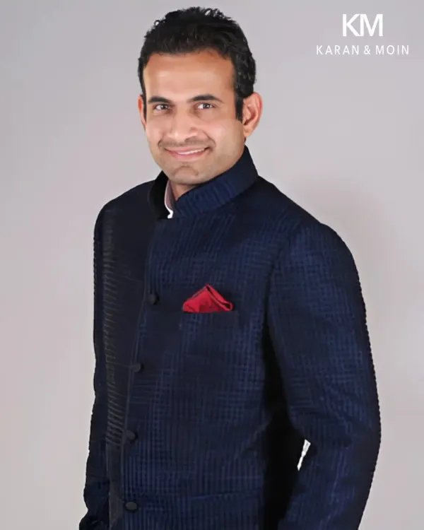 Cricketing icon Irfan Pathan in a custom navy textured bandhgala. The structured fit and the confident pairing with a bold red pocket square capture the balance and lasting impression that every modern gentleman seeks.