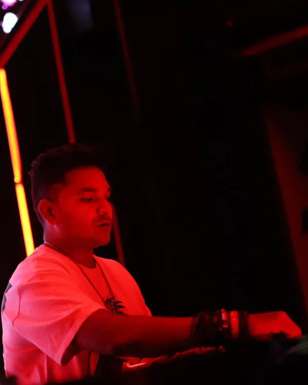 Lost in the music under the red lights of the club. Every set is about finding that perfect groove and taking the crowd with me on a sonic journey.