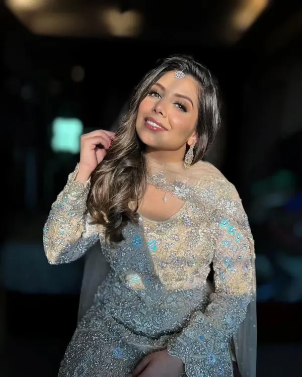 A perfect example of 'sunkissed glam' suitable for outdoor or golden-hour shoots. The radiant skin, soft smokey eye, and glossy lip create a look that is both elegant and modern, ideal for lifestyle or festive campaigns.
