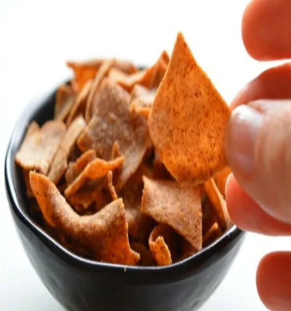 A handful of my baked multigrain chips. These are seasoned just right and provide a satisfying crunch, making them a great alternative to fried potato chips.
