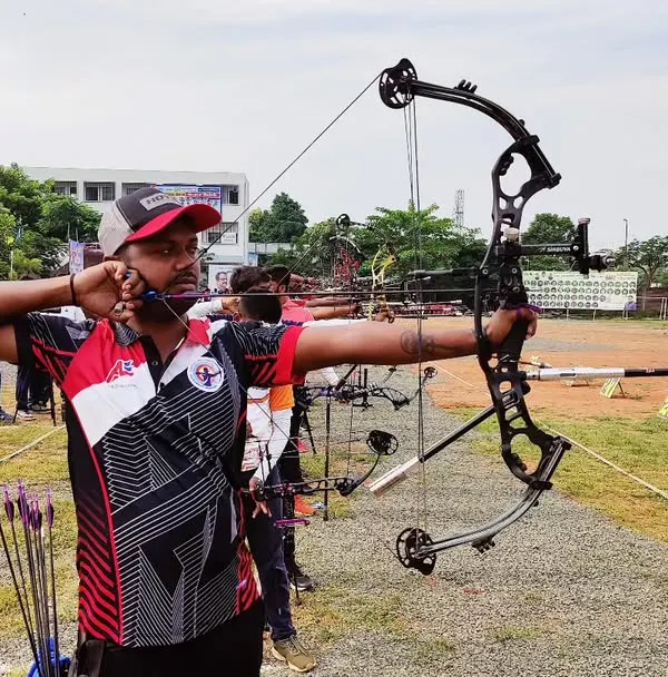 The intensity of competition is where our training pays off. This is one of our senior archers demonstrating perfect compound bow technique during a state-level event.