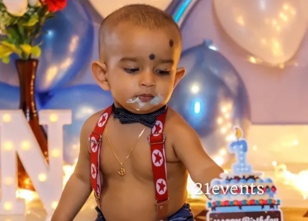 A classic cake smash moment! I can provide a simple setup to capture this fun first birthday tradition.
