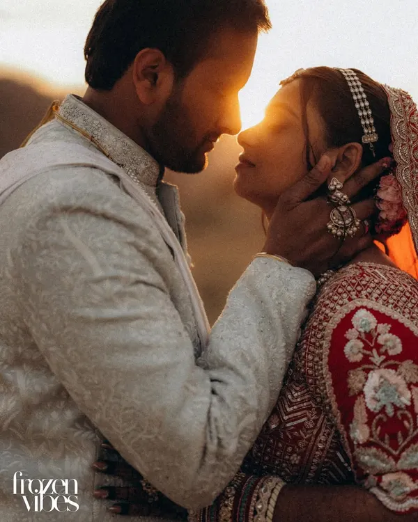 This is the kind of magic I live to capture. The sun dips low, creating a perfect golden flare as Malay and Nishi share a quiet, intimate moment. It’s more than a photo; it’s a feeling, frozen in time.