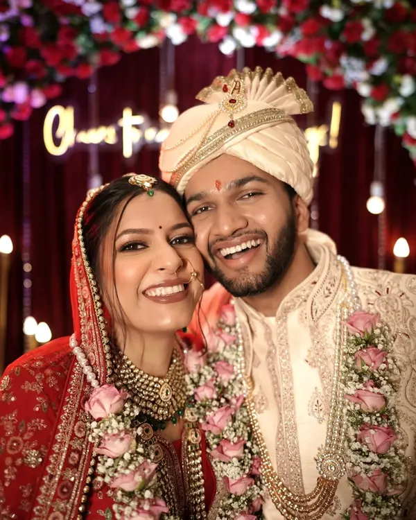 The classic red bride, redefined. For Neha's wedding, we created a natural, radiant look that perfectly complemented her stunning red lehenga. Her smile says it all.