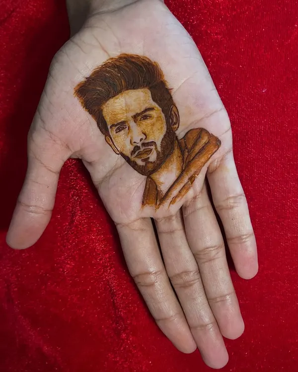 A portrait of Bollywood actor Kartik Aaryan, created entirely with henna. This showcases my ability to capture realistic likenesses, a skill I love bringing to my bridal and custom designs.