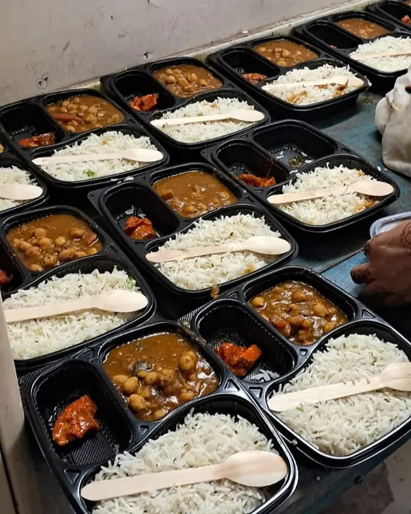 Our Ganesh Chaturthi special meal boxes, featuring delicious onion and garlic free food like Chole, Rice, and Pickle.