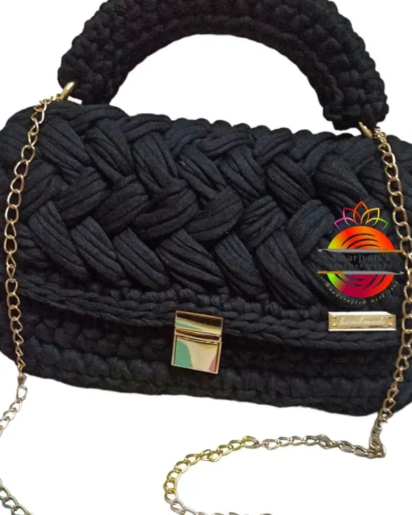 This is my signature handcrafted handbag, made from thick and sturdy t-shirt yarn. The braided texture gives it a luxurious feel, and it comes with a durable top handle, a secure gold-tone clasp, and a matching chain strap for crossbody wear.