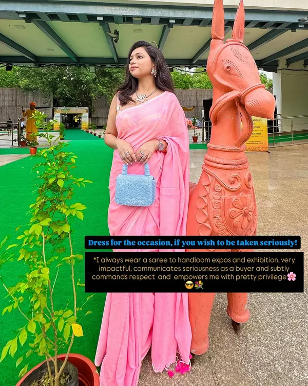 Dress for the occasion if you wish to be taken seriously. Here, I've paired a simple pink saree with a contrasting light blue bag, showing how a pop of color in your accessories can make a huge impact.
