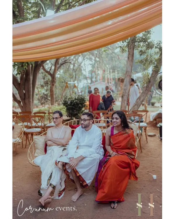 Guests enjoying the intimate setting of a backyard Tamil wedding. The decor was kept simple with light drapes to create a warm, enclosed feel.