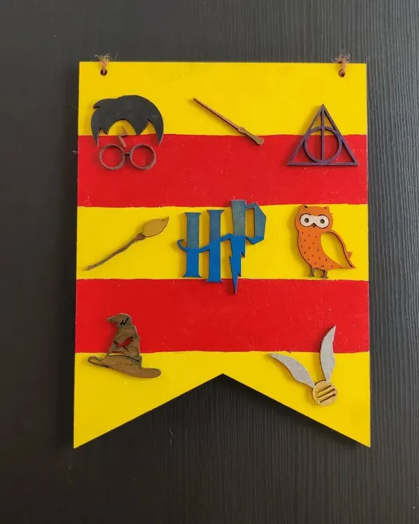 A finished Harry Potter banner, created from one of my themed DIY kits. This is a fantastic activity for a magical birthday party, letting every little wizard create their own flag.