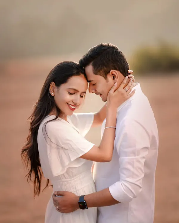 A moment of pure connection. The soft light, the gentle touch, and the serene expressions on Atul and Rachita's faces make this a classic, romantic portrait. It’s about capturing the feeling of being home with someone.
