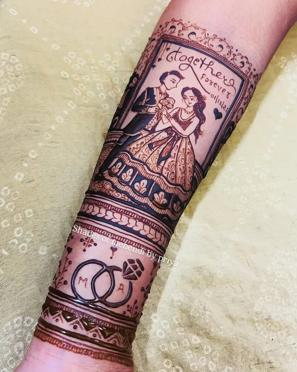 This is one of my favourite bridal pieces. It tells a complete story on the arm, with a custom portrait of the couple, their engagement date, and intertwined wedding rings with their initials. This is the kind of personal, detailed work I love to create for a bride's special day.