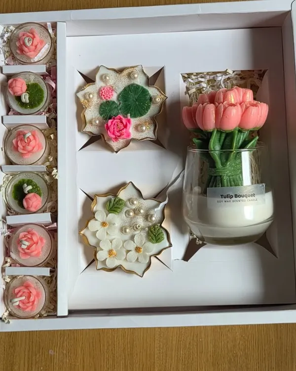 This large custom gift box shows the variety I can offer for corporate gifting or special occasions. It features a stunning tulip bouquet candle, decorative floral urlis, and a set of smaller scented candles, all beautifully arranged.