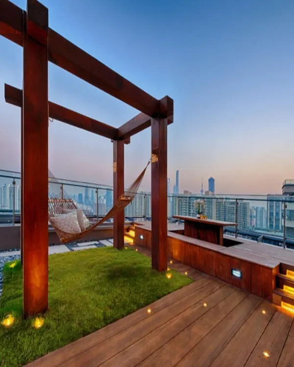 An example of a high-end intensive roof garden designed for lifestyle. We integrated a soft lawn, custom woodwork for seating and a pergola, and ambient lighting to make this rooftop a luxurious extension of the living space.