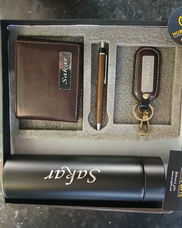 A complete 4-piece corporate gift set. This combo includes a personalized leather wallet, pen, keychain, and a name-engraved temperature bottle, all packed in a premium box.