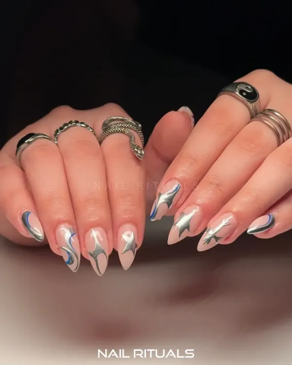 Silver stars and cosmic swirls give this set a celestial energy with every gesture. This edgy design features metallic silver art with a hint of blue on a nude base.