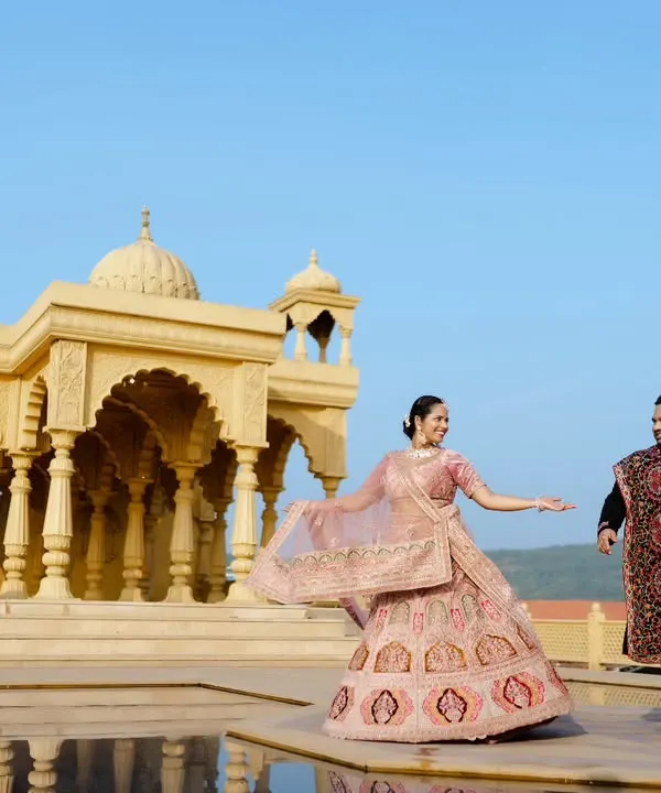 A majestic backdrop for a love story that feels like royalty. I focus on capturing movement and emotion, making you feel like the main characters in your own romantic film. This shot was taken at a stunning architectural location near Pune.
