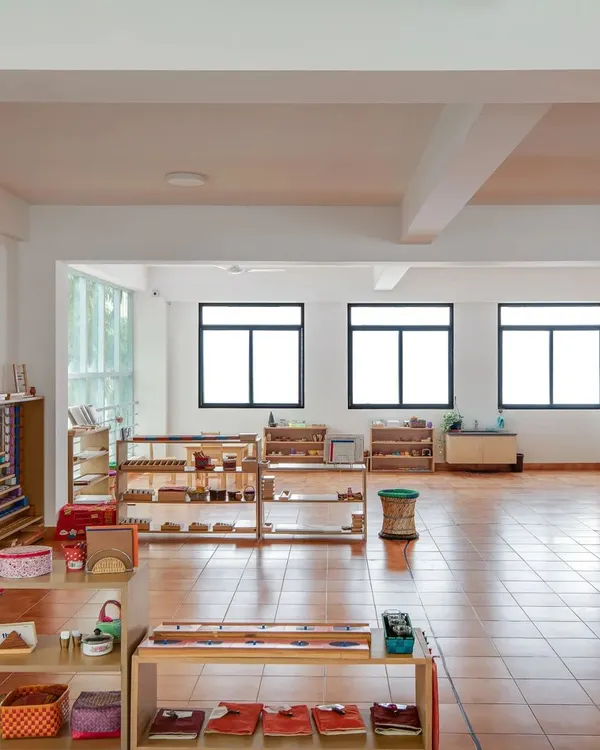 A view of our bright, open, and orderly classroom. The low shelves with accessible materials invite children to explore and choose their own work, fostering independence.