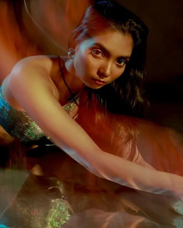 This is where we play with light and motion. Using a slow shutter speed, I created these dreamy light trails for a high-fashion, editorial feel. It’s a perfect example of a creative concept shoot.