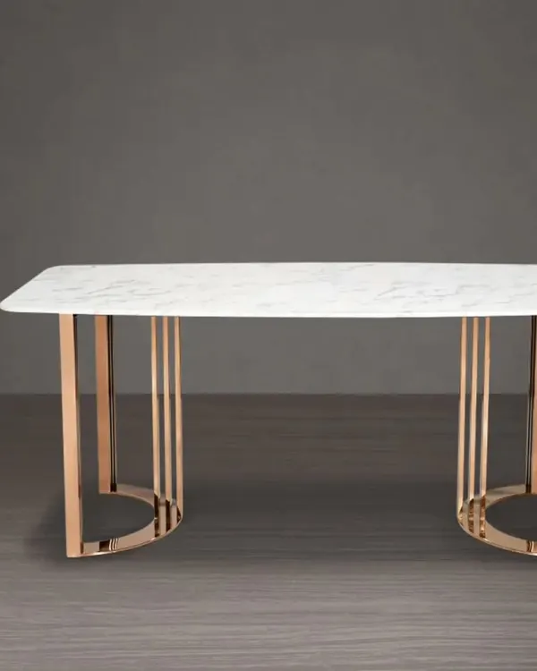 This make-to-order dining table features a white marble top and a striking rose gold metal base. It's a luxurious centerpiece for any modern dining room.