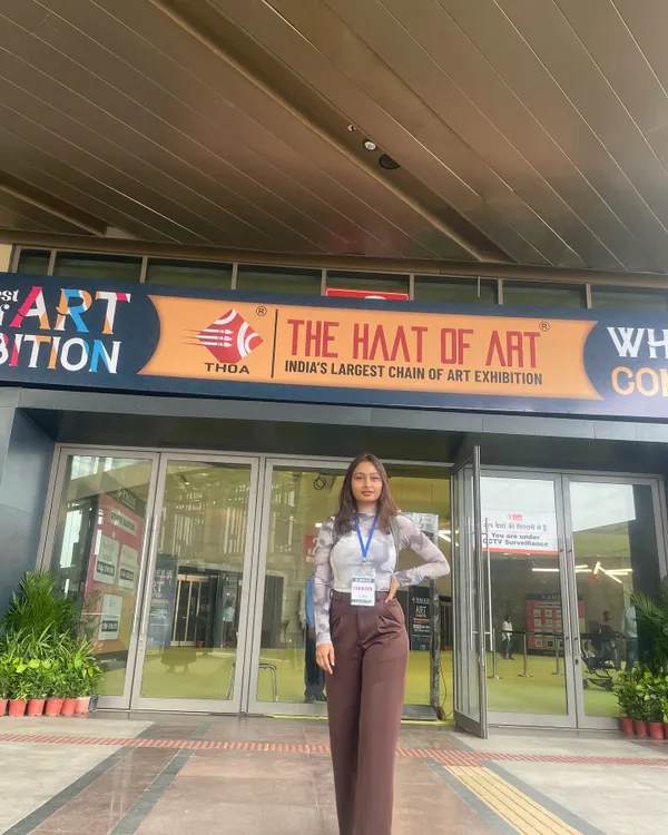 Standing outside 'The Haat of Art', India's largest chain of art exhibitions. Participating in events like this is a dream come true and allows me to share my creative vision with a wider audience.