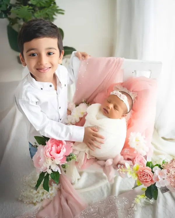 The beginning of a lifelong friendship. I love capturing the pride and gentle curiosity of a big brother meeting his new baby sister, preserving this precious milestone for your growing family.