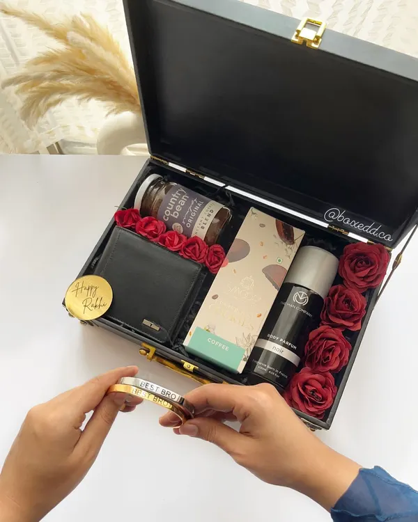 A luxurious Rakhi hamper for your brother, featuring a leather wallet, perfume, and a personalized stainless steel 'Best Bro' bracelet.