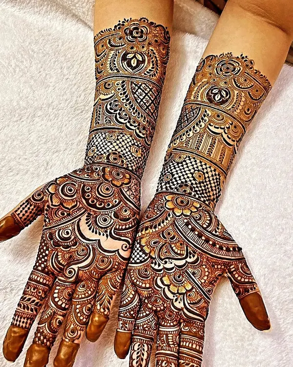 A fresh application of a heavy, detailed design suitable for any grand celebration. Notice the clean linework and the mix of traditional motifs with modern shading techniques for a standout look.