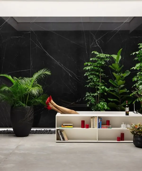 In this 9,000 sq. ft. tile showroom, a pair of crimson stilettos peeks out from a bathtub, a playful scene of opulent indulgence. We designed this space as a canvas where every tile tells a story of style, sophistication, and imagination.