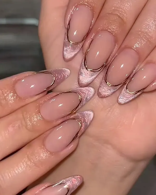 This is the kind of set that makes you feel like the main character. We combined a soft pink cat-eye effect with a delicate gold chrome outline on perfectly shaped almond extensions for a look that is pure elegance.