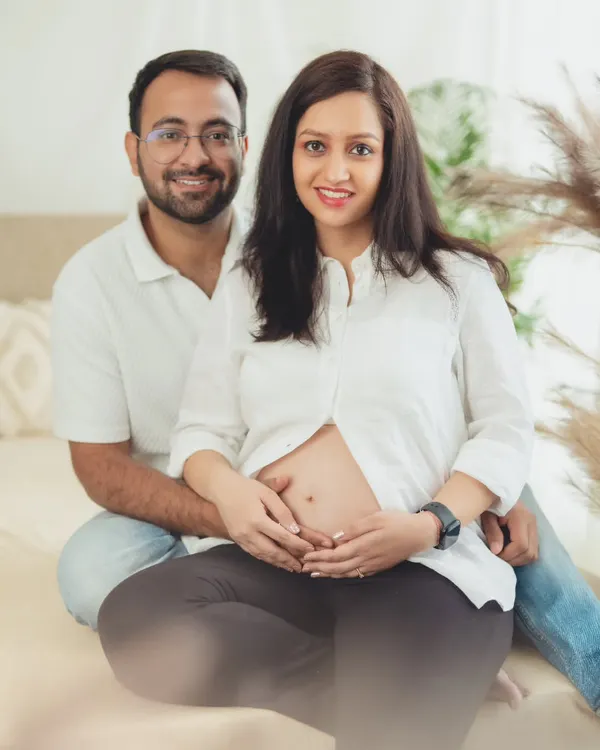 A classic and happy couple's portrait, dressed in simple white shirts and casual wear, focusing on their joyful connection.
