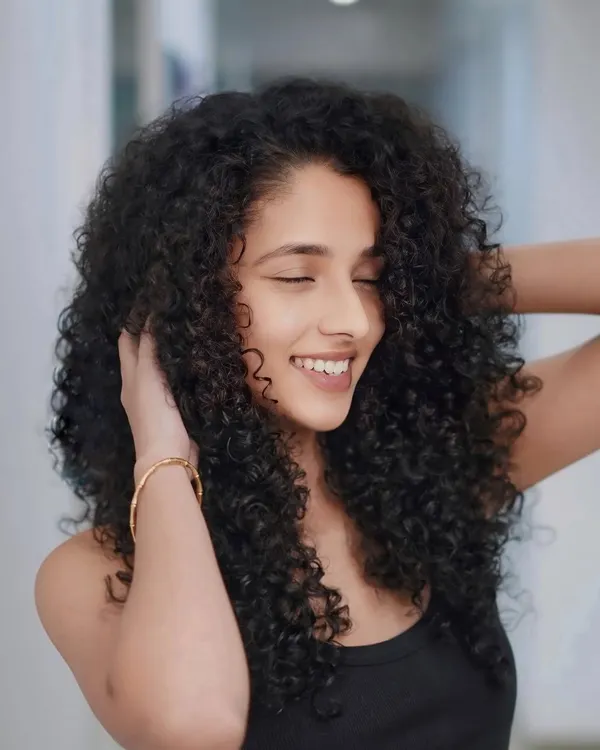 Curls that bounce, radiate, and shine with every turn. We specialize in dry-cutting techniques for curly hair to create the perfect shape.