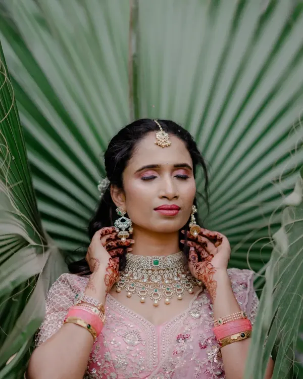 A beautiful engagement look. I used soft pink and mauve tones on the eyes and lips to complement her pastel lehenga, creating a romantic and dreamy feel.