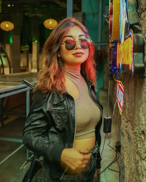 A stylish shot against a neon-lit background. I love edgy, cool aesthetics that match my music and personality.