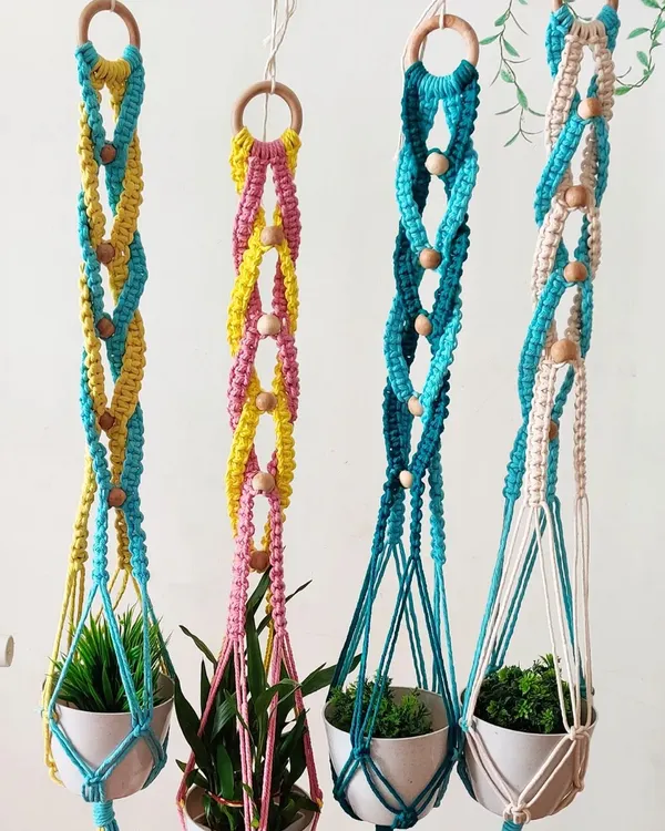 My colorful macrame plant hangers are a beautiful way to display your favorite plants. They are available in many two-tone color combinations to match your decor.
