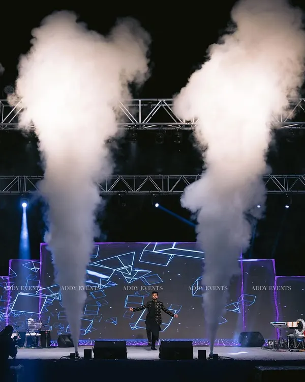 We create electric atmospheres that make your brand the main event. This shot captures the peak of a high-energy performance, complete with custom stage lighting and dramatic fog effects designed to captivate any audience at a corporate gala or product launch.