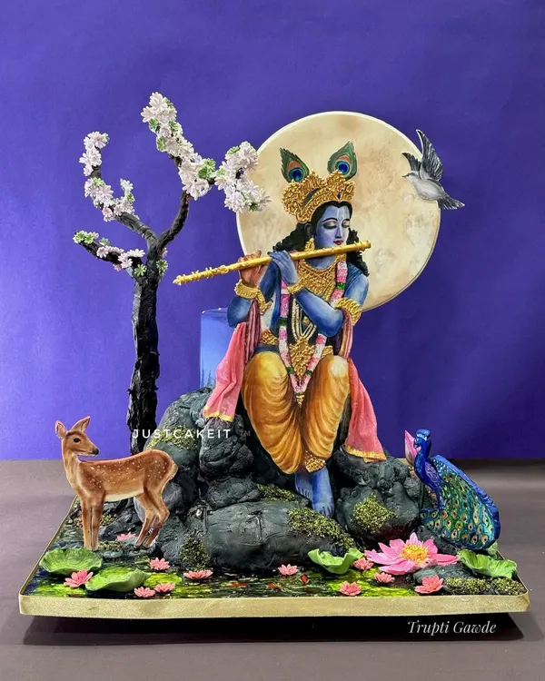 This hand-painted cake, depicting Lord Krishna playing his flute, was a meditative process that took 12 days to create. Every element, from the serene expression to the enchanted animals, is edible and hand-crafted.