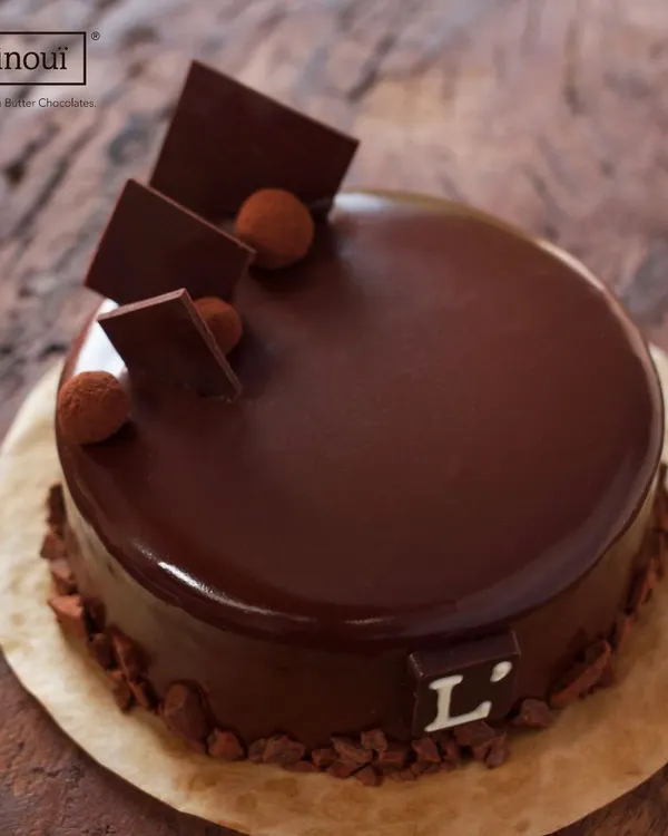 A closer look at our signature Belgian Truffle Cake. Notice the deep, glossy sheen of the ganache, a sign of true couverture chocolate. This is the standard of quality you can expect in every cake we bake.