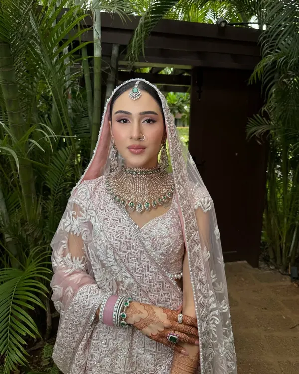 Blush pink perfection for this bride's daytime wedding in Goa. Her soft and romantic makeup look was created to complement her Manish Malhotra lehenga, with an emphasis on glowing skin and delicate pink tones.