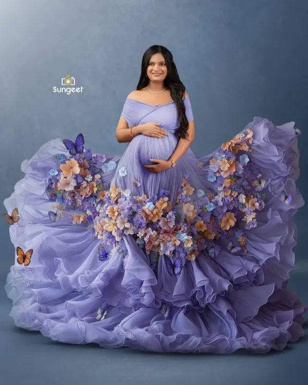 One of our most magical creations. This mother-to-be is wearing a custom-designed purple gown that transforms into a cascade of flowers and butterflies, creating a truly unique piece of art.