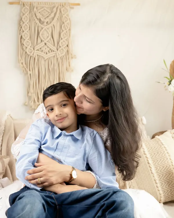 A mother's gentle kiss. These are the quiet, love-filled moments I aim to freeze in time during my family portrait sessions.