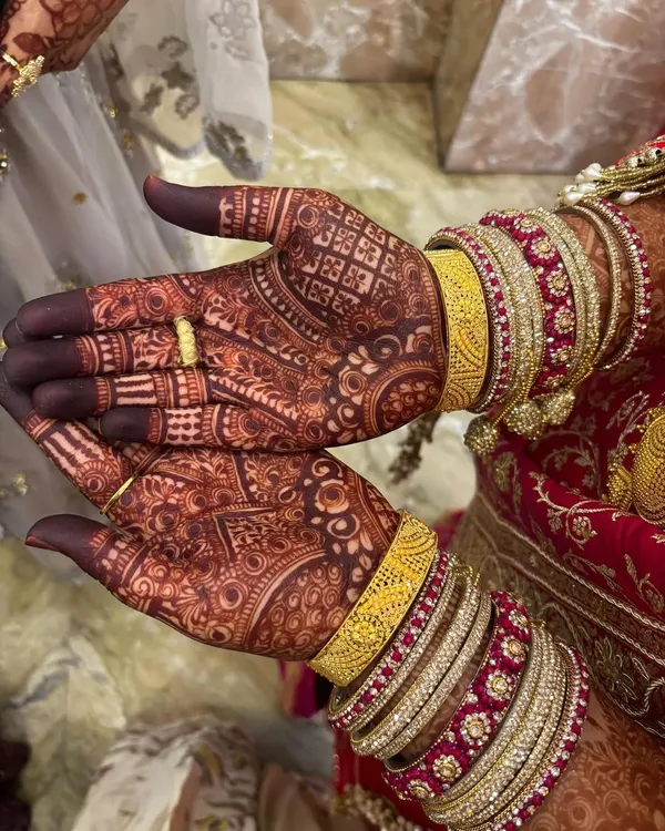 The result of my organic henna after 48 hours. The color has developed into a deep, rich maroon, which looks incredible with bridal bangles.