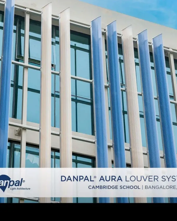 A closer look at the Danpashade Aura Louvers on the Cambridge Junior School. The reflective blue, amber, and opal panels create a dynamic facade that changes with the light, providing both beauty and energy-efficient shading.
