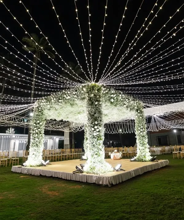 A breathtaking mandap under a canopy of baby's breath and a sky of twinkling fairy lights. This is where I transform venues into ethereal dreamscapes for your most sacred moments.