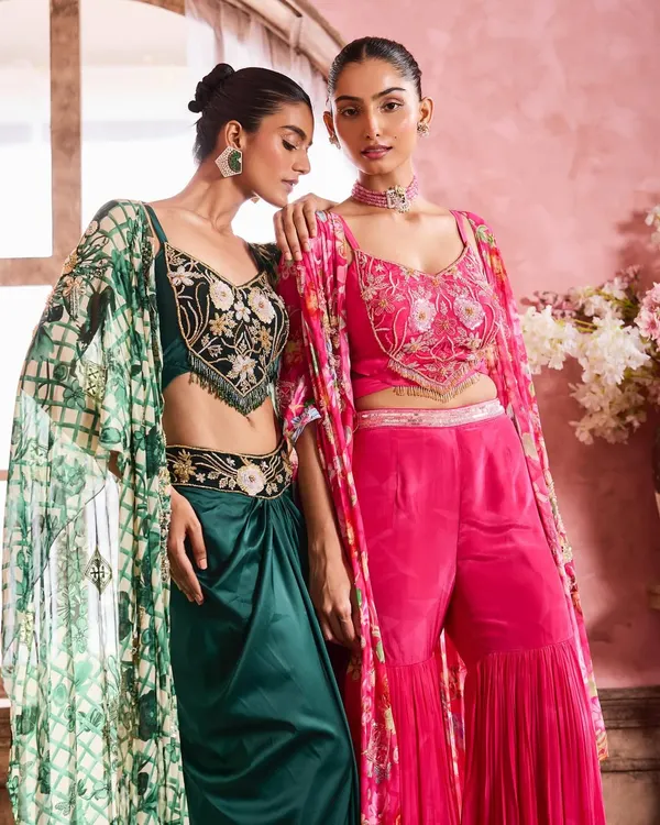 A beautiful duo look featuring complementary makeup styles. One model wears a soft glam look with a pink-toned lip, while the other has a slightly bolder eye, showcasing my ability to create cohesive looks for your bridal party.