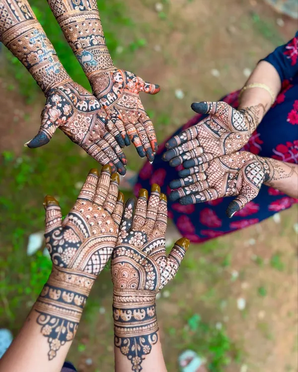 A beautiful shot capturing the mehendi for the bride and her loved ones. We can create coordinated designs for your entire bridal party.