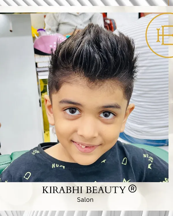 A cool and stylish haircut for this young man. We gave him a modern faux hawk with faded sides, a look that's both fun and easy to manage.