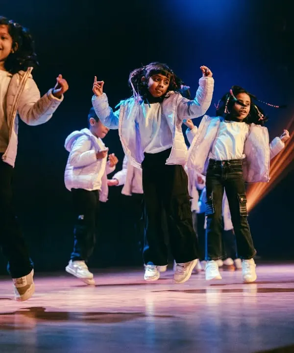 This is the moment it's all about. The pure joy and confidence shining on stage during our annual performance night. We work to give every child this feeling of accomplishment and excitement.