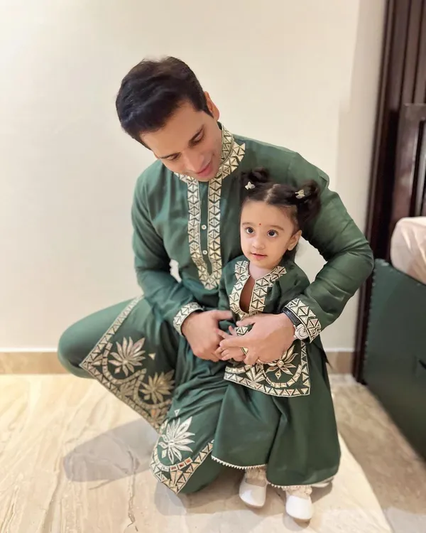 A heartwarming father-daughter moment. I designed these twinning outfits for Diwali, featuring a bottle green mul mul kurta with leather embroidery for dad and a matching mini version for my daughter, Aarriya.